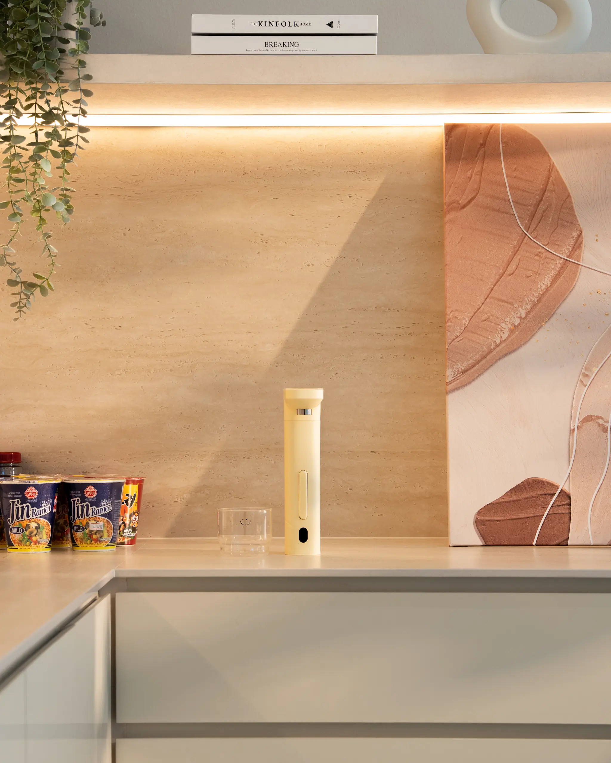 Happie dispenser placed on a kitchen countertop, showcasing its compact, minimalist design and easy access for daily use.